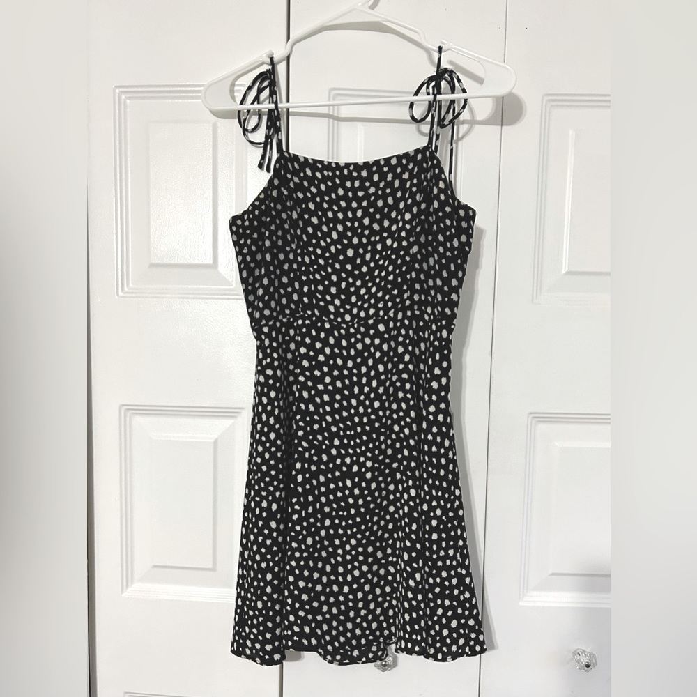 Mini black and white dotted sun dress with bows on straps!